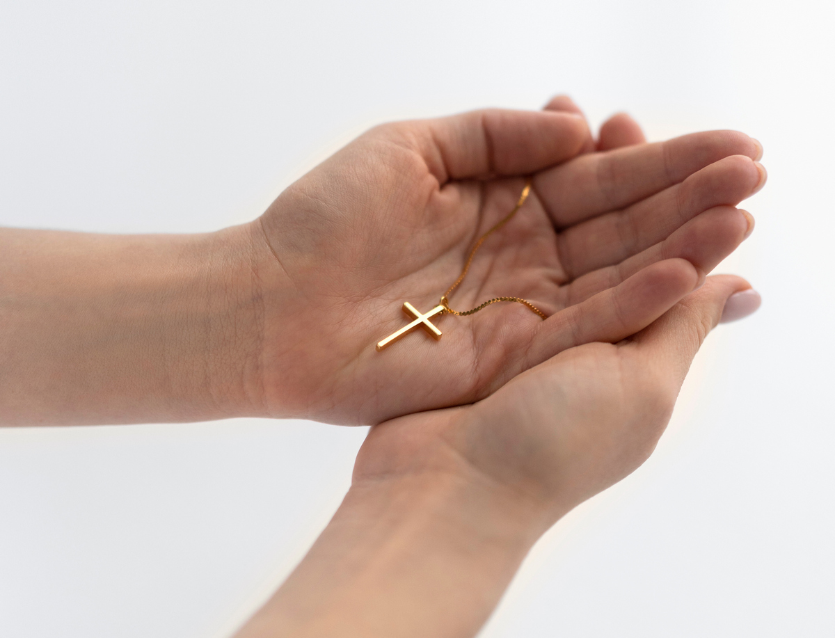 close-up-hands-holding-crucifix.jpg