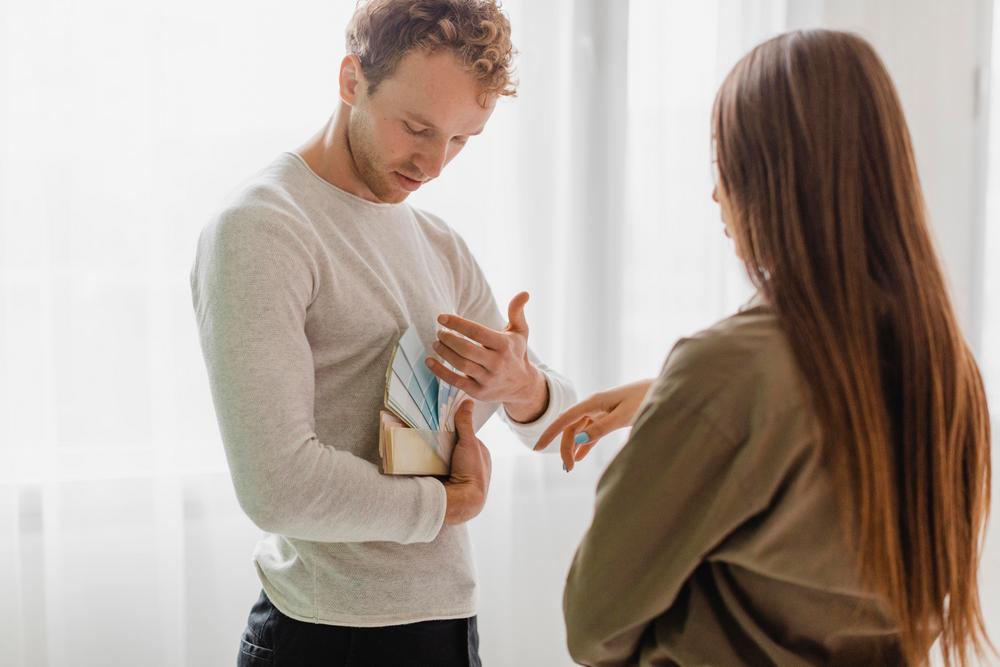 couple-deciding-redecorate-house-using-paint-palette.jpg
