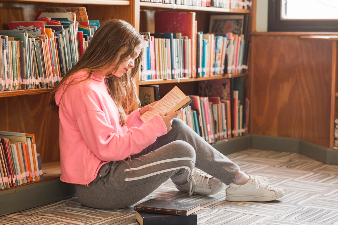 girl-reading-near-bookcase_23-2147863571.jpg